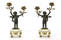 Lot 154 - A pair of 19th century bronze and marble cherub candlesticks