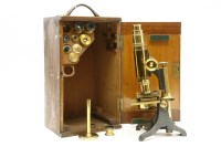Lot 188 - A Baker brass and iron microscope