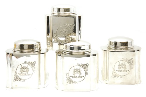 Lot 161 - A set of four silver plated tea canisters