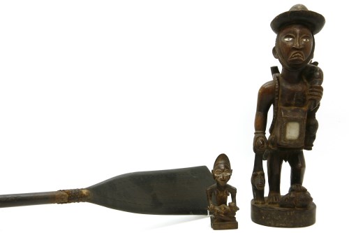 Lot 190 - A 20th century carved African figure