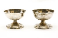 Lot 106 - A pair of George III hammered silver circular salts