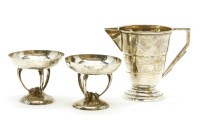 Lot 102 - A pair of Art Nouveau hammered silver salts on open bases
