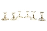 Lot 105 - Three pairs of early 20th century silver dwarf candlesticks