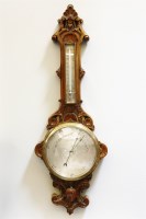 Lot 275 - A late Victorian walnut cased aneroid barometer