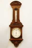 Lot 265 - A late 19th century oak cased aneroid barometer
