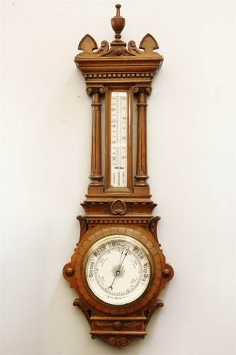 Lot 263 - A late 19th century large oak cased aneroid barometer