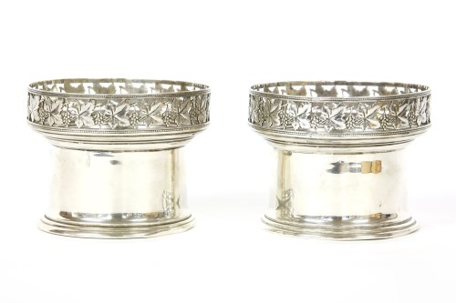 Lot 91 - A pair of silver wine related cylindrical vessels
