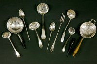 Lot 62 - A collection of silver strainers to include tea and fruit examples (qty)