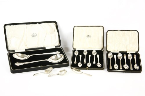 Lot 70 - A cased pair of silver serving spoons