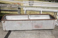 Lot 592 - A large riveted water trough with zinc coating