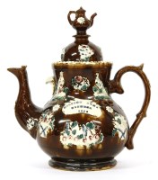 Lot 246 - A 19th century Bargeware pottery teapot