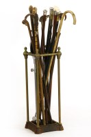 Lot 391 - A brass and cast iron stick stand