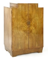 Lot 463 - An Art Deco walnut crossbanded dressing cabinet