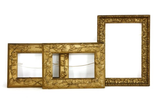 Lot 173 - A pair of decorative gilt frames with applied leaf motif