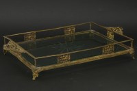 Lot 214 - A gilt metal and glass mounted tray