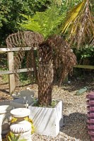 Lot 568 - A tree fern in a square reconstituted stone pot