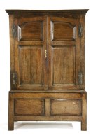 Lot 385 - An 18th century oak hanging cupboard