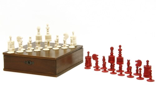 Lot 78 - A 19th century bone red and natural coloured chess set