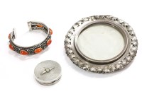 Lot 45 - A silver cuff bangle set with Cornelian cabochons