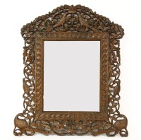 Lot 251 - An Anglo Indian mirror with ornate carving of birds