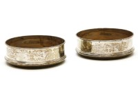 Lot 97 - A pair of silver bottle coasters