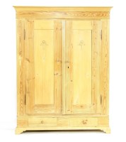 Lot 508 - A two door stripped pine wardrobe