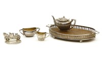 Lot 78A - A miniature silver three piece tea set on a tray