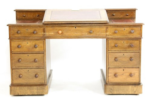 Lot 374 - A late Victorian oak Dickens desk