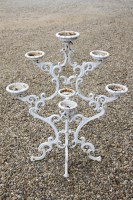 Lot 590 - A cast iron six branch pot stand