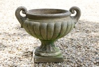 Lot 596 - A twin handled terracotta garden urn