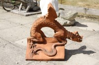 Lot 601 - A terracotta ridge tile surmounted by a dragon