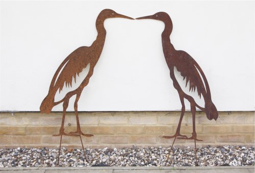 Lot 602 - A pair of life size metal garden silhouettes of herons with ground stakes