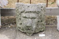 Lot 611 - A weathered cast stone lion fountain mask