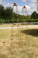 Lot 620 - A pair of hand forged wrought iron 'Abingar' square based garden obelisks with ball finials