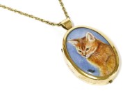Lot 100 - A red Abyssinian 9ct gold painted ceramic plaque of a cat pendant in gold mount