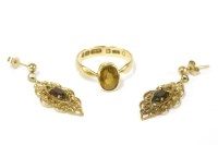 Lot 81 - A rub set oval cut citrine set to a later 18ct wedding ring