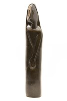 Lot 412 - An African carved stone figure of a female figure in a robe
