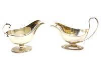 Lot 211 - A Mappin & Webb George III style sauce boat