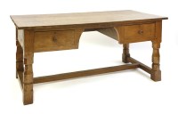 Lot 182 - A Robert 'Mouseman' Thompson oak library table