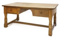 Lot 183 - A Robert 'Mouseman' Thompson oak library table