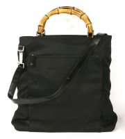 Lot 1014 - A Gucci black canvas cross-body handbag