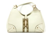 Lot 1154 - A Gucci small cream leather handbag