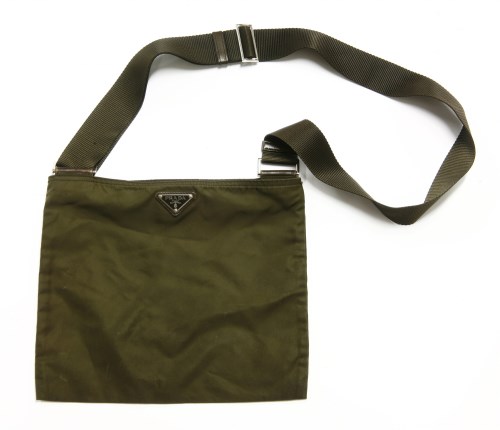 Lot 1100 - A Prada khaki green canvas messenger handbag
