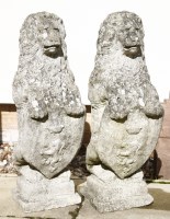 Lot 814 - A pair of reconstituted lion figures