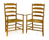 Lot 668 - A pair of Cotswold armchairs