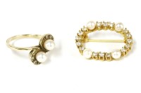 Lot 63 - A German cubic zirconia and cultured pearl oval brooch
