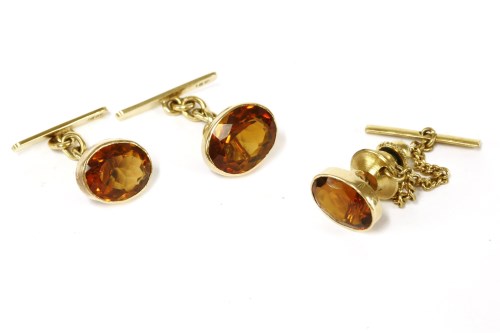 Lot 34 - A cased pair of gold rub set oval cut citrine chain link cufflinks