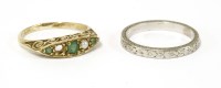 Lot 73 - A gold emerald and cultured pearl boat shaped ring