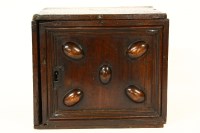 Lot 725 - An early 18th century oak spice cabinet