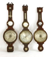 Lot 518 - A very large mahogany combination clock barometer